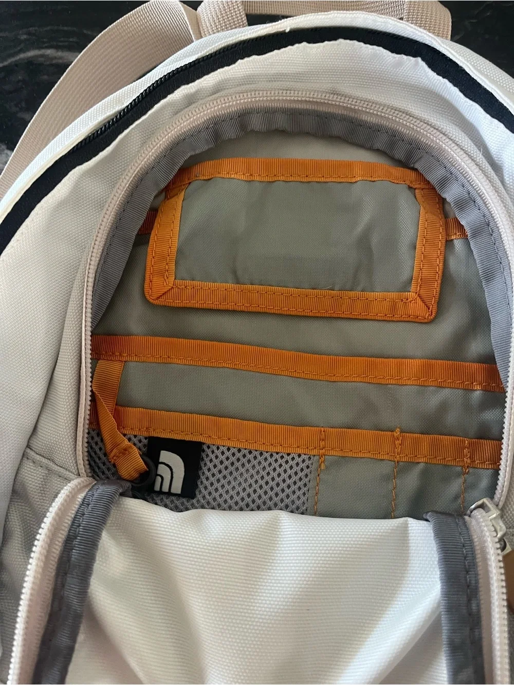 The North Face Cream and Gray Mini Backpack with Tan Accents